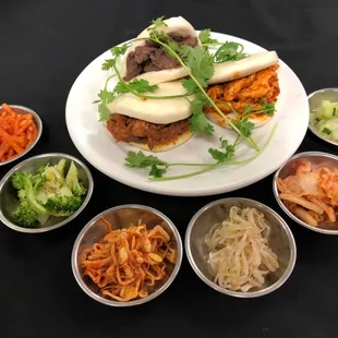 Guabao with your choice of meat: bulgogi, chicken bulgogi, and korean spicy chicken. Topped with sliced cucumbers, carrots and cilantro