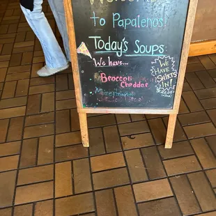 a chalk board with a sign that says welcome to papatones today's soups