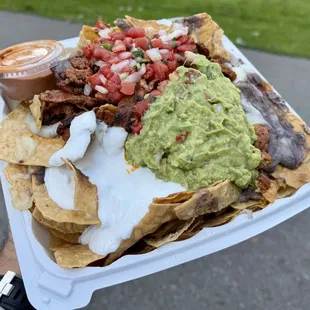 Al pastor nachos. Tasty &amp; well portioned, but pricey at ~$20 after 4.5% surcharge. No salsa by default ($0.50 per 2-oz cup, top-L)