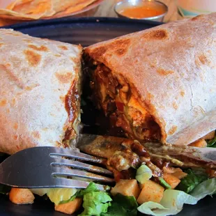 Mole tofu burrito with sour cream, salsa, and guacamole. Too salty!!!