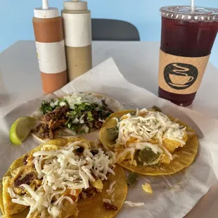 Cachete (Barbacoa) on flour, bacon egg &amp; cheese, and nopal (cactus) egg &amp; cheese, with a Hibiscus drink. Also the red salsa is my favorite.