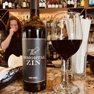 a glass of wine and a bottle of wine