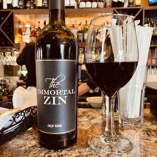 a glass of wine and a bottle of wine