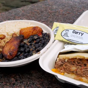 Pabellon Criollo Papabowl (left): rice, shredded beef, black beans, sweet plantains, Monterrey cheese ($12.99). Beef Arepa (right) ($10.99).