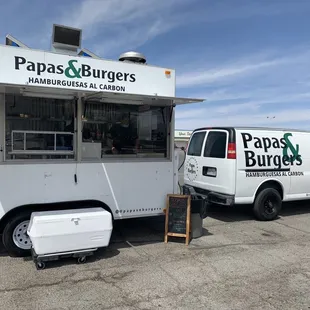 two vans parked in a parking lot