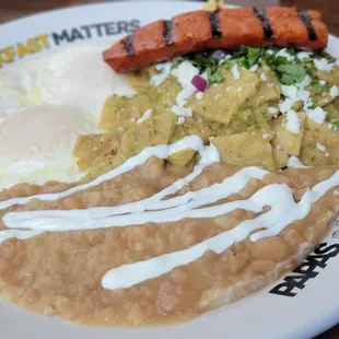 Green Salsa Chilaquiles with $3.00 Eggs over easy and $4.00 Linguiça