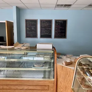a bakery counter with a variety of pastries