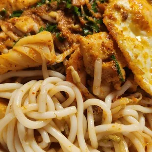 Seafood laksa.  Added an egg on our own at home.