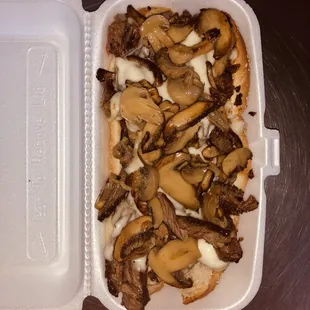 Steak sub with swiss cheese and mushrooms
