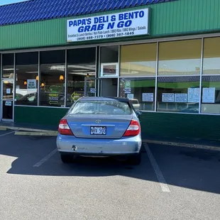 a car parked in front of a restaurant