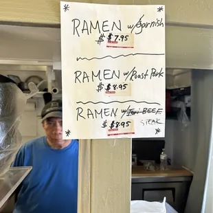 a man behind a sign