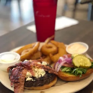 Bison burger with blue cheese, bacon, and a side of awesome onion rings.