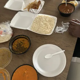 (Left to right) Mixed Vegetable Tikka Masala Curry, Samber Soup, Chicken Tenders and Fries, Goat Curry Meat