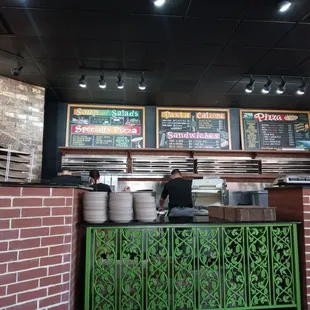 menus on a brick wall