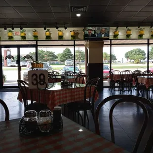 a restaurant with tables and chairs