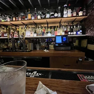 a glass of water on a bar