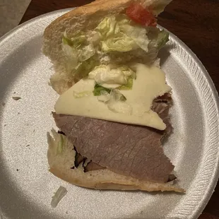 a sandwich on a paper plate