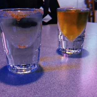 two glasses of beer on a table