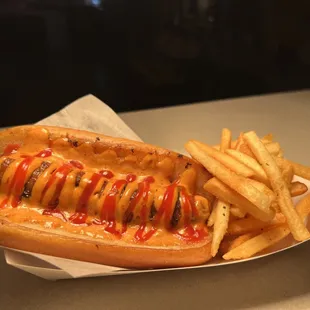 Bacon Wrapped Hot Dog with a side of Fries