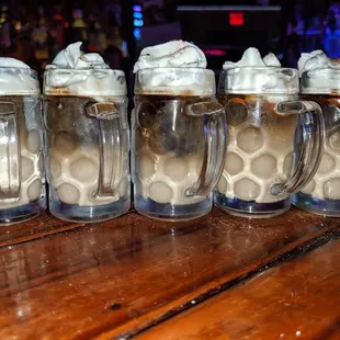 a row of mugs filled with ice cream
