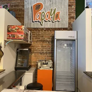 a kitchen with a refrigerator and counter