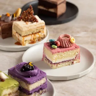 a variety of cakes on plates