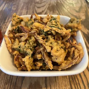 Some kind of onion thing like a glob of onion rings all mashed together