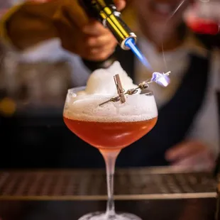 a bartender making a drink