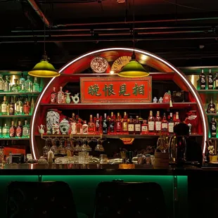 a neon sign above the bar