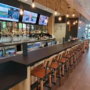 bar seating and televisions