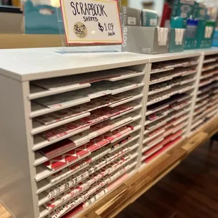 Our scrapbooking section is growing each day, with beautiful double sided paper and durable adhesives and stamps.