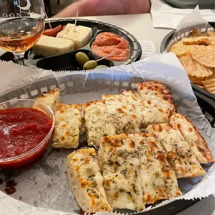 Cheesy bread, cheese plate, chips and what's left of Twilight.
