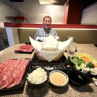 10 oz American Wagyu on the left with vegetables; lamb in the background