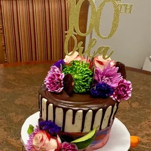 Custom vanilla cake with chocolate filling &amp; chocolate ganache. Real flowers for someone that doesn't love frosting ones.