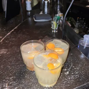 three glasses of orange juice