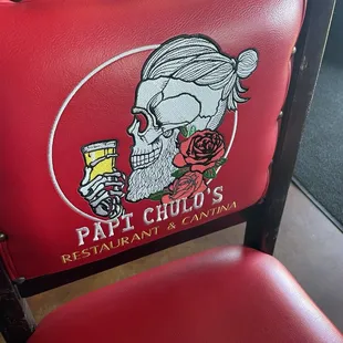 Papi Chulos logo on chair