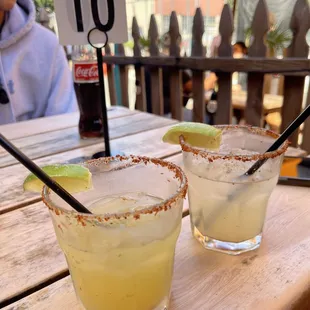 two margaritas on a table