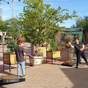 Outdoor bean bag game while you wait for your order