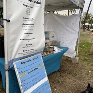 a dog standing in front of a tent