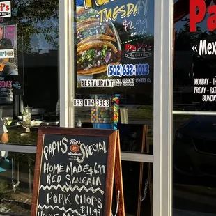 a sign in front of a restaurant