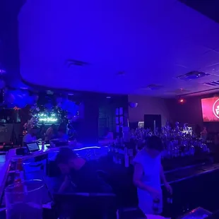 a bar with purple lighting