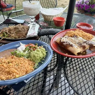 Pork carnitas, guacamole, rice and beans, mole chicken enchiladas.