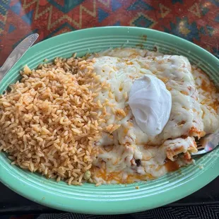 Enchiladas Rancheras (ground beef and chicken with extra cheese on top)