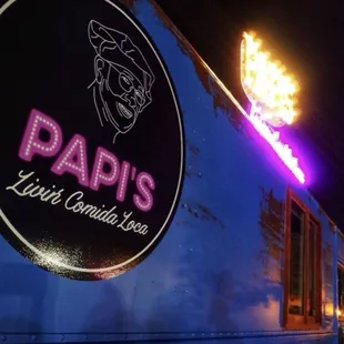 a neon sign on a blue train