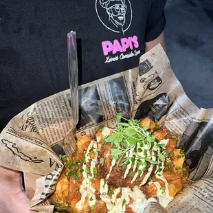 a man holding a basket of food