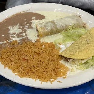 One beef enchilada (with queso), one beef taco