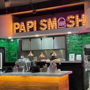 a neon sign above the counter