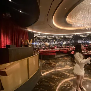 a woman standing in a restaurant