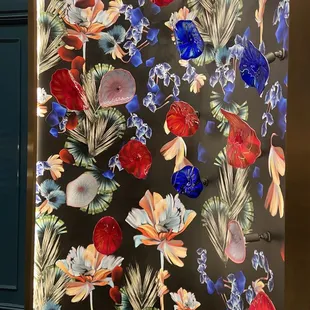 a colorful floral design on a black background