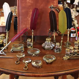 Lovely feather pens. I purchased the navy one to the far right ($35) and the brass holder.